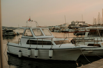 Fototapeta premium There are many yachts, boats and ships at sea. Marina at sunset.