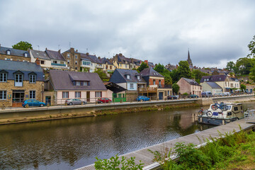 Fototapeta na wymiar Josselin, France. Picturesque embankments of the L'Oust river