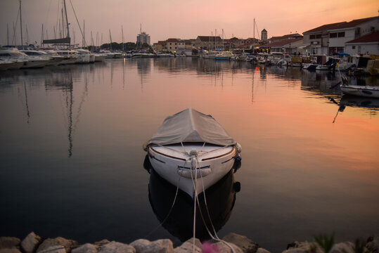 There are many yachts, boats and ships at sea. Marina at sunset. Vosice Croatia Gorgeous summer sunset by the ocean
