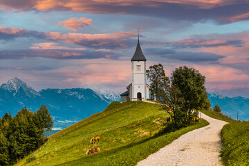 Fototapeta na wymiar Picturesque Church Of St Primoz.in Jamnik,Kamnik, Slovenia at Autumn at Sunset