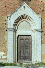 Fototapeta na wymiar marble portal of san Franceso church, Montepulciano, Siena, Italy
