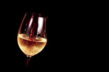 A glass of champagne on a black background. Rough plan side view. There is a place for an inscription. Postcard, invitation, congratulation, element for design.