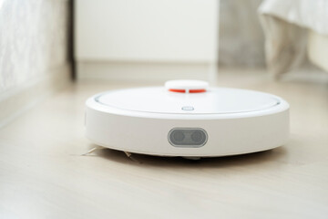 robot vacuum cleaner does cleaning in the apartment
