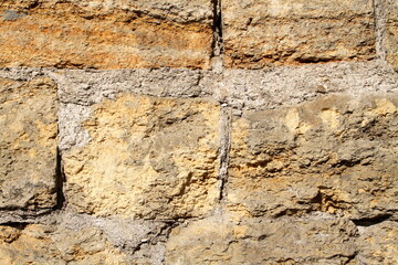 texture of an old wall with cracked paint and peeling plaster