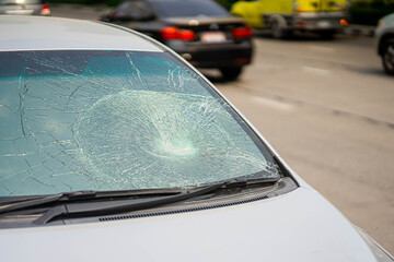 Fototapeta na wymiar Closeup of car with broken windshield, Car crash accident damaged on the road car crash accident on street in the city road.