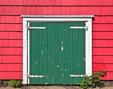 Red Shingled Barn With Closed Green Stable Door. Possibly Santa's Reindeer Shelter.