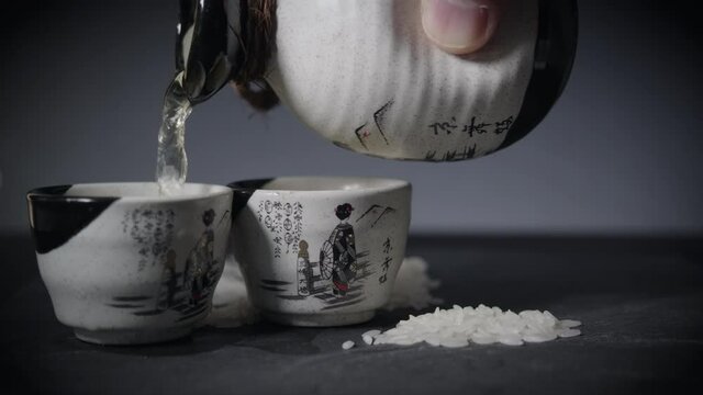 Pouring Sake with Sake Cup and Sake Bottle
