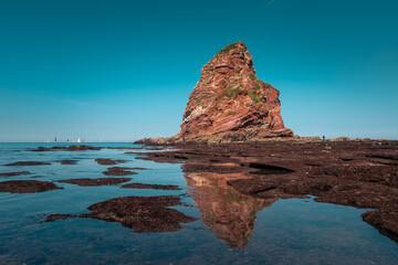 Rocky beach next to the famous twin rocks of Hendaia at the Basque Country's coast.