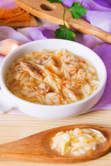 Instant chicken noodle soup in a white ceramic bowl