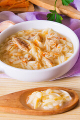 Instant chicken noodle soup in a white ceramic bowl