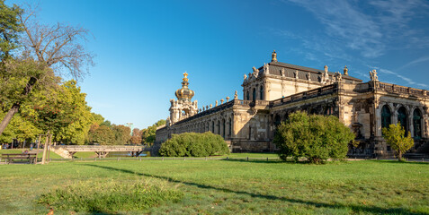 Fototapeta na wymiar Dresden Zwinger City morning View with blue sky and warm colors 