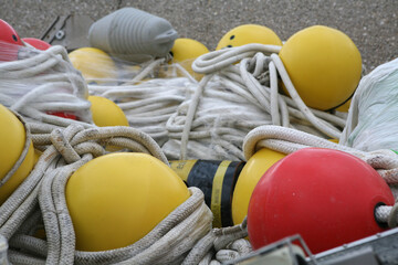 Buoys and ropes in the port - 389711728