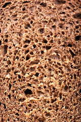 The texture of the cut of traditional wheat-rye bread.