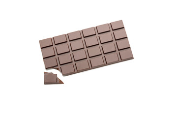 A bar of natural dark chocolate on a white background with a broken piece