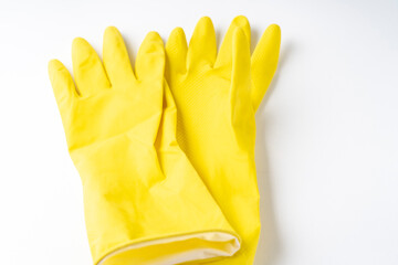 latex gloves on a white background, yellow dishwashing gloves isolated