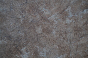 the texture of the stone wall in different shades. Abstract background of light to brown color.