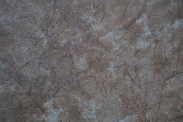 the texture of the stone wall in different shades. Abstract background of light to brown color.