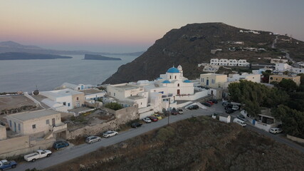 Aerial view flying small town on Santorini Greece