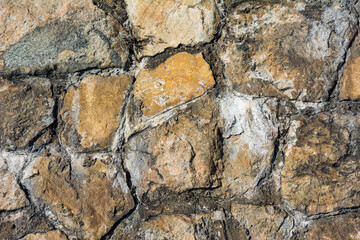 Light yellow masonry made of natural stone.