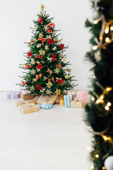 Christmas tree decor pine with gifts for the new year interior