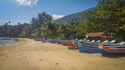 Fototapeta na wymiar Ilha Bela boats in Brazil. Amazing beach and beautiful colors