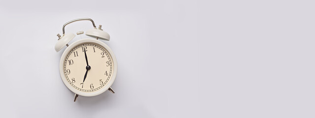 Alarm clock on the background. close up. 7 am. Banner