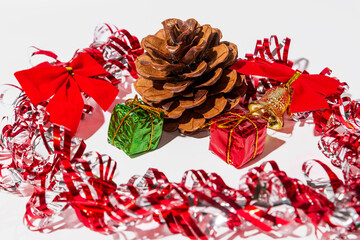 Close up pine cones and christmas decoration on a white wooden table background. Christmas and new year concept.