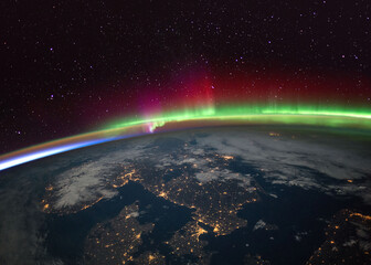 Aurora Borealis (Northern Lights) over Scandinavia from the International Space Statio (ISS). Elements of this immage supplied by NASA. - obrazy, fototapety, plakaty
