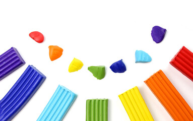 colored rainbow plasticine on isolated white background