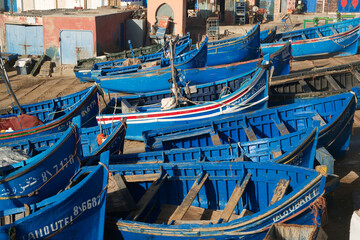 Fototapeta na wymiar blue fishing boats drying out