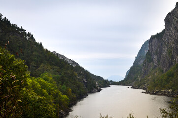 Panoramic view of a norwegian fjord and mountains - 389725129