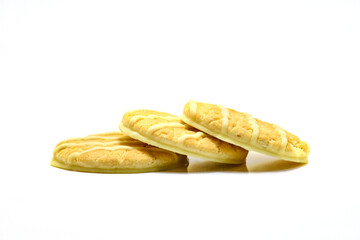 biscuit with  stream of cream on a white background
