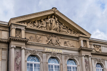 Fototapeta na wymiar View of Baden-Baden Theater (1862) building. Baden-Baden Theater - neo-baroque white-and-red sandstone building. Baden-Baden, Germany.