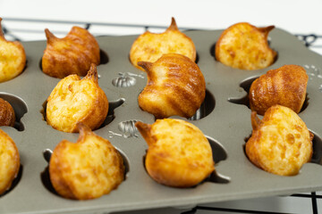 Brazilian snack cheese bread or pao de queijo in pumpkin shape