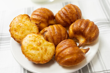 Brazilian snack cheese bread or pao de queijo in pumpkin shape