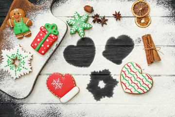 Flat lay composition with delicious homemade Christmas cookies and flour on table
