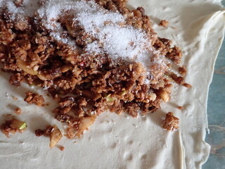 Fototapeta premium preparation of a homemafe apple strudel