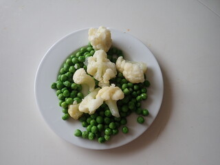 green peas and cauliflower in the bowl