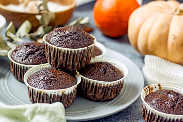Homemade gluten-free muffins with chocolate close-up. Gluten-free flour cupcakes with chocolate on a green plate with a napkin on a dark table. Low Carb Sugar Free Cupcakes