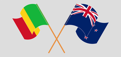 Crossed and waving flags of Mali and New Zealand