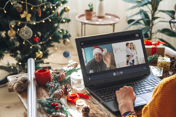 young woman with laptop over christmas tree background