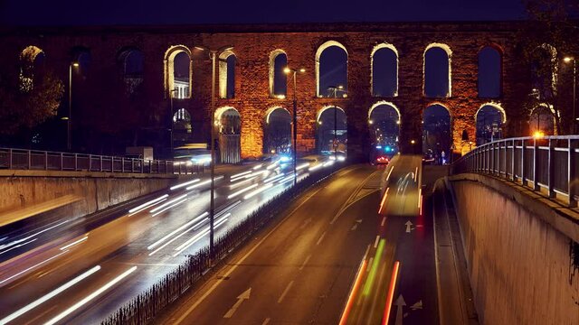 Time lapse clip near Valens Aqueduct (Bozdogan Su Kemeri) in evening with traffic of cars, Istanbul, Turkey. It was a water-providing system of the Eastern Roman capital Constantinpole