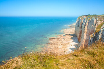 The chalk cliffs in Etretat in french Normandy, atlantic coast of France. Summer view of atlantic ocean.
