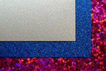 Full frame abstract art overlay background of sparkling white blue and red glitter textures, with bokeh and copy space