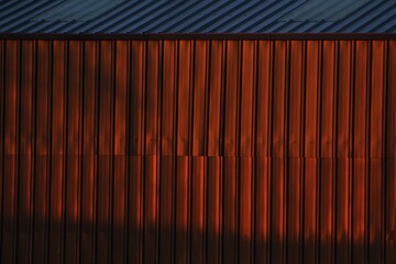 Sunset reflected on corrugated iron shed