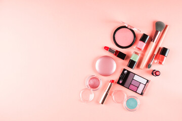 Beauty make up accessories - blush, eye shadows, lipsticks, nail polish, brushes on pink background - 389738315