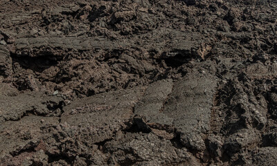 Looking out over a huge basalt lava flow surface at Isaac Hale Beach Park created by 2018 eruption and lava flow of Kilauea volcano on the Big Island of Hawaii, USA