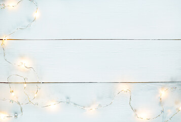 white wood horizontal texture background with yellow garland and Copy space