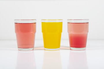 Glasses of lemonade in colors representing flag of Spain. It is a photo in a series of similar photos perfect to use in a quiz.