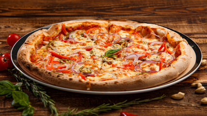 Pizza with holopeno, onion and cheese on wooden background